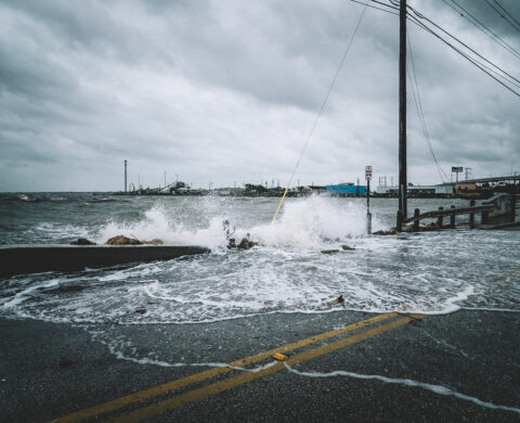 Water crashing over bridge during Hurricane