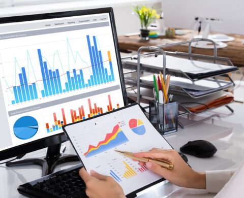 Businesswoman Checking Graph In Office