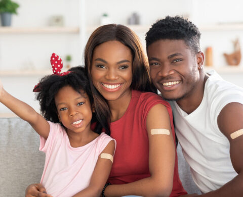 Vaccination Concept. Black Vaccinated Family Of Three With Adhesive Bandage On Arms